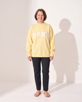 Pastel Yellow with White Letters